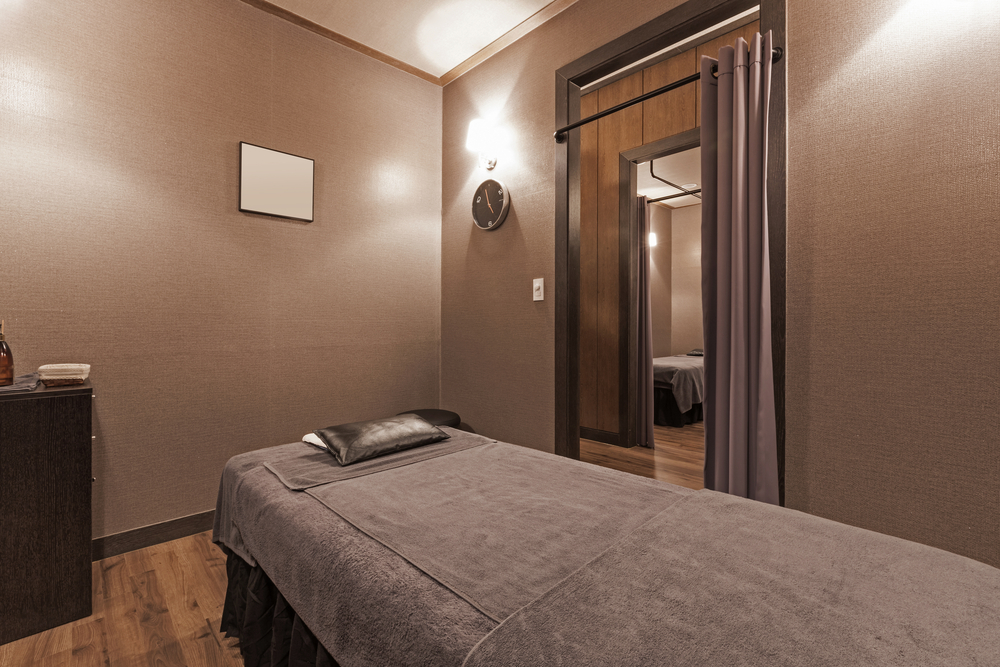 a,massage,room,with,bed,,brown,blanket(covers,,comforter,,duvet,,bedding,